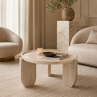 Table basse surélevée en oxyde de magnésium aspect travertin avec plateau rond et support à 3 points pour salon et décoration intérieure
