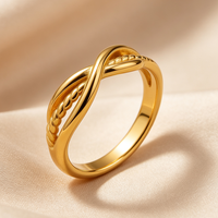 Bague unisexe tendance en acier inoxydable plaqué or 18 carats avec pierres précieuses, torsadée et entrelacée à double enroulement