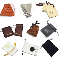 Pochette à bijoux en velours suédé gris avec ruban et logo en feuille d'argent, faible MOQ, vente chaude 2026