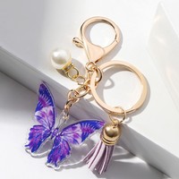 Vente en gros porte-clés personnalisé imprimé de luxe fermoir mousqueton perle papillon pendentif style dessin animé sac voiture acrylique porte-clés gland