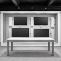Vitrine d'exposition personnalisée pour téléphones portables avec grande table d'expérience en îlot pour magasin de détail d'accessoires électroniques modernes