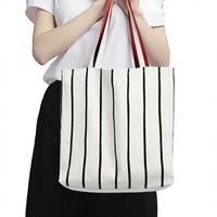 Sac fourre-tout en toile à rayures noires avec logo personnalisé, impression haute visibilité, sac à bandoulière réutilisable pour événements promotionnels et cadeaux d'entreprise