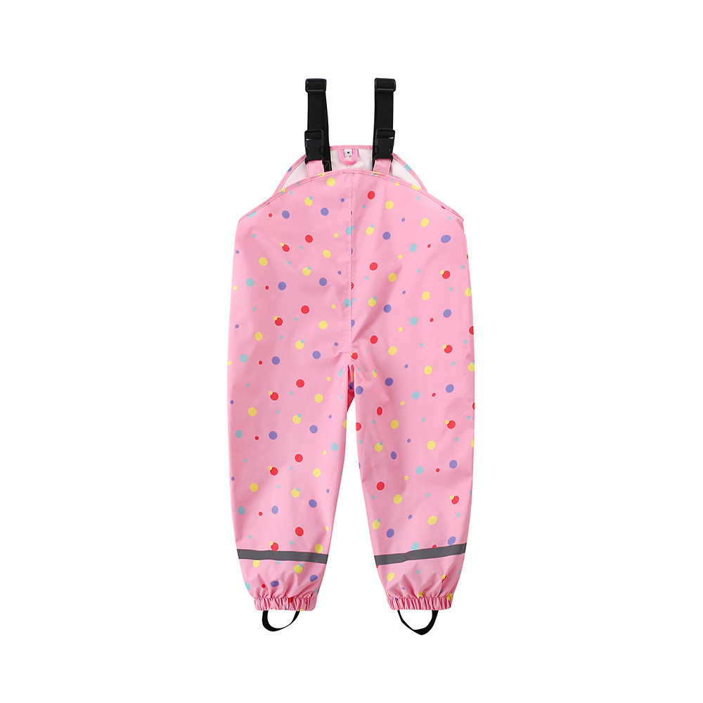 Pantalon à bretelles à pois roses
