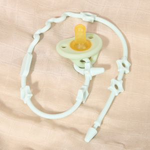 Attache-tétine en silicone avec poignée pour bébés de 0 à 12 mois, sans BPA, en matériau de qualité alimentaire, design en forme d'arc - Product Image 1