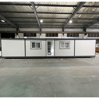 Maison pliable en conteneur extensible à double aile de 40 pieds, conforme aux normes australiennes, préfabriquée, avec toit plat de 2,4 m, 3 à 4 chambres