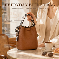 Sac seau pour femme en cuir marron caramel avec poignée tressée, porté épaule ou croisé, base structurée, usage quotidien, vente en gros