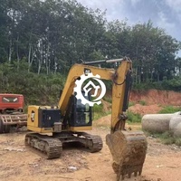 Excavatrice compacte sur chenilles d'occasion CAT 310 avec moteur puissant et performances hydrauliques fluides