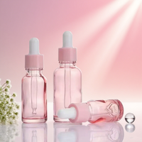 Bouteille d'huile essentielle en verre rose de fantaisie de 20ml en forme de cylindre avec compte-gouttes pour la beauté soins de la peau sérum et crème Commande minimum 500 pièces