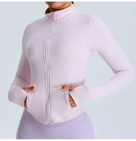 Veste de yoga en gros à fermeture éclair, manches longues, coupe ajustée, avec trou pour le pouce, col montant, pour la course et le sport