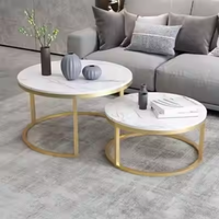 Table d'appoint ronde en métal noir et or avec plateau en verre, céramique ou marbre texturé pour salon