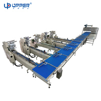 Ligne d'emballage à grande vitesse de flux de rouleau suisse de gâteau de livre de cupcake machine de paquet de gâteau acier inoxydable de bonne qualité