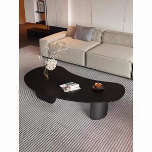 Table basse moderne en dalle noire avec plateau en métal de forme irrégulière pour salon - Product Image 1