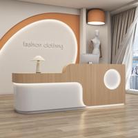 Comptoir de réception pour salon de beauté avec éclairage LED, design moderne et épuré, finition peinture cuite durable pour magasins de détail
