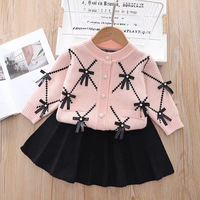 Ensemble de deux pièces en tricot pour filles, nouveau style, avec cardigan décoré d'un nœud pour les bébés filles