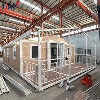 Maison préfabriquée de luxe à mur bleu JJM Australie Standard 20 pieds 30 pieds 40 pieds Conteneur extensible Maison Pliable Immeuble de bureaux en acier