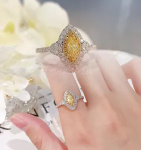 18k Gold White Color Sidestone And Yellow Color Egg Shape Main Diamond Marquise Design Ring