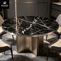 Table à manger ronde en marbre noir de luxe moderne, table à manger pour villa, base en métal incurvée unique, couleurs et dimensions personnalisables