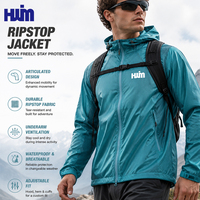 Veste imperméable haute mobilité personnalisée pour homme en tissu Ripstop avec fermetures éclair intégrales et manches articulées pour l'exploration en canyoning