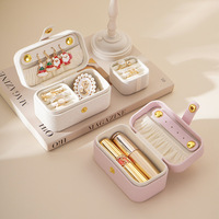 Boîte à bijoux personnalisée en cuir PU miniature avec bouton pression doré, organiseur portable pour bagues, boucles d'oreilles et rouges à lèvres, étui de voyage, vente en gros OEM