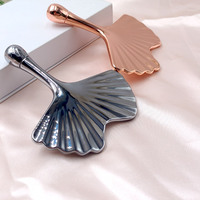 Outil de massage facial en métal XUNMEI en forme de feuille de Ginkgo pour le visage, le cou et le corps – Planche de Gua Sha pour le soin de la peau