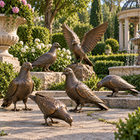 statues de pigeons en bronze