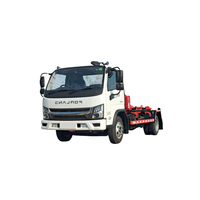 Camion à benne à bras articulé avec conteneur compacteur pour la compression des déchets à haut volume et les opérations d'assainissement municipal efficaces