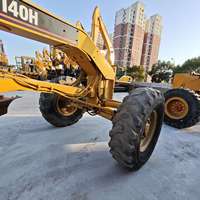 Niveleuse à moteur Caterpillar CAT 140 H d'occasion robuste avec lame de nivellement et moteur Bullgrader