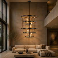 Lustre à anneaux superposés noir Cano Lighting, anneaux métalliques avec intérieur doré sur un pied vertical, luminaire de plafond moderne et industriel