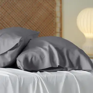 2024 แบรนด์หรูที่กําหนดเองไม้ไผ่ Lyocell ผ้าคลุมเตียงปลอกหมอนและเบาะชุด 4 ชิ้นออกแบบผ้าปูที่นอน