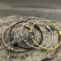 Bracelet Yiwu Aceon en acier inoxydable avec câble torsadé, fermoir magnétique ovale, double perle d'espacement, centre carré, cube estampé, éclairé