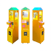 Meilleure vente : Mini machine de jeu de grue jaune, à monnayeur électrique, en métal, distributeur de prix à monnayeur, jouet, Garantie 1 an, Transfrontalier