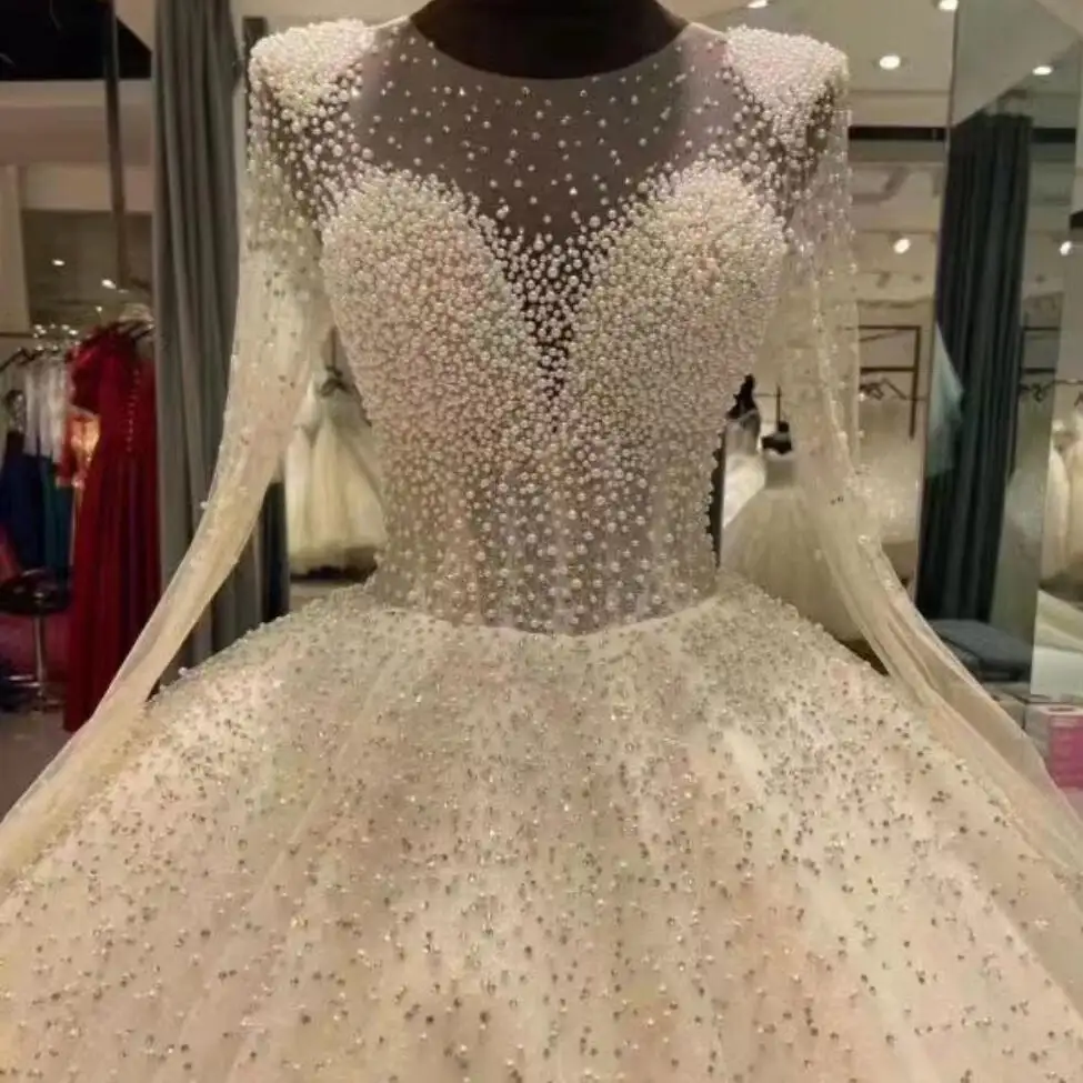2023 Luxury Heavy Pearls Beaded Wedding Dresses Long Sleeves Plus Size African Bling bling Ball Gown Wedding Dress