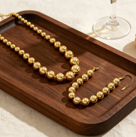 Parure de bijoux fantaisie pour femme en acier inoxydable, collier et bracelet à chaîne perlée, avec billes dorées graduées et sphères rondes polies