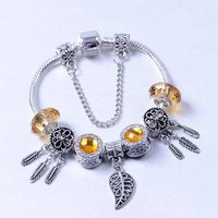 Bracelet en alliage doré avec perles de cristal, opale, attrape-rêves et feuille ajourée pour femme et couple