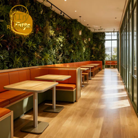 Canapés en forme de L personnalisés avec un espace privé, associés à des tables à cadre en acier inoxydable, sont le choix idéal pour les restaurants
