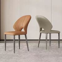 Chaise de salle à manger moderne avec dossier découpé élégant et pieds en métal fins pour la maison, les restaurants, les hôtels et les cafés