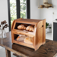 La boîte de rangement à pain à deux couches en bois d'acacia avec des couvercles de fenêtre en verre pour le stockage des aliments dans la cuisine.