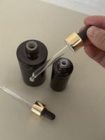 Flacon rond en verre ambré de 30 ml et 100 ml avec bouchon compte-gouttes doré et bulbe en TPE noir pour huile pour le visage et huile pour les cheveux