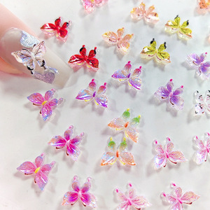 Nouveauté : 50 pièces/sac, breloques 3D papillon pour nail art, papillons colorés lumineux pour nail art - Product Image 1