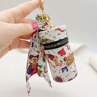 Nouveau porte-clés de luxe en cuir pour femme, design de créateur, pour clés de voiture, breloque de sac, porte-monnaie et porte-rouge à lèvres