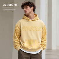 Sweat à capuche personnalisé OEM ODM à carreaux gingham avec empiècements contrastants et appliqués, effet délavé, usine BSCI, lots flexibles, streetwear éco-responsable