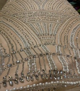 Tissu brodé à la main de créateur en maille et dentelle avec perles et paillettes pour la confection de vêtements de fête et de mariée - Product Image 1