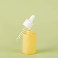 Flacon compte-gouttes en verre givré rond 20ml 30ml, base épaisse avec logo personnalisé pour l'emballage de produits de soin de la peau