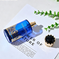 Flacon de parfum en verre de luxe en gros avec bouchon doré orné d'une couronne, idéal pour l'emballage de parfums premium du Moyen-Orient de 100 ml
