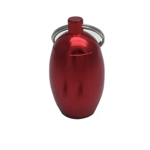 Hot sale oval egg-shaped metal earplugs waterproof storage pill box bottle key chain keychain