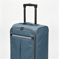 Valise souple pliable à roulettes en tissu bleu avec poches organisatrices frontales, poignée télescopique et protections d'angle