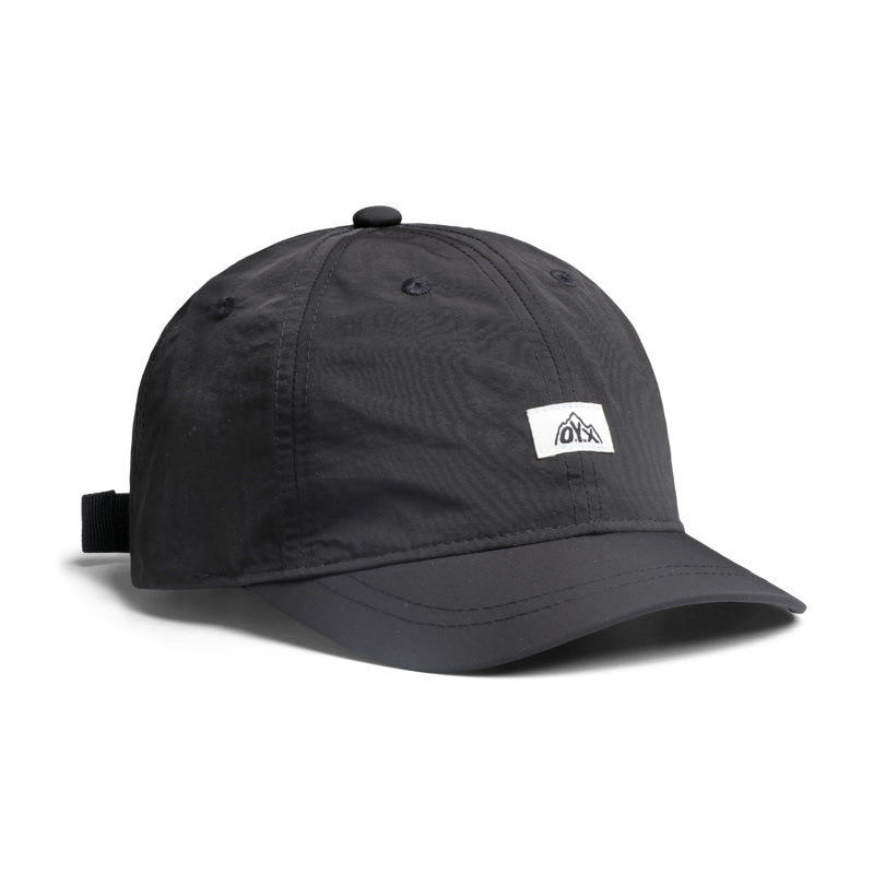Casquette noire à visière courte OYX, séchage rapide.