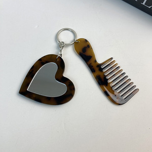 Mini Pettine Portatile SAIYII di Alta Qualità a Forma di Cuore con Specchio Piccolo Pettine in Acetato a Denti Larghi Effetto Marmo Accessori per Capelli Portachiavi - Product Image 3