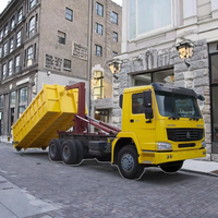 SINOTRUK HOWO 6X4 25ton crochet ascenseur camion à ordures compacteur mobile conteneur à ordures avec crochet bras camion