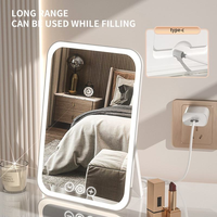 Miroir de maquillage LED pliable de table, carré, en verre, rechargeable par USB, finition argentée, écran tactile portable, marque personnalisée, vente en gros